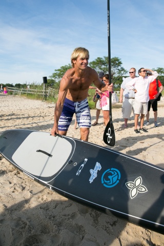 Laird Hamilton with board paddle